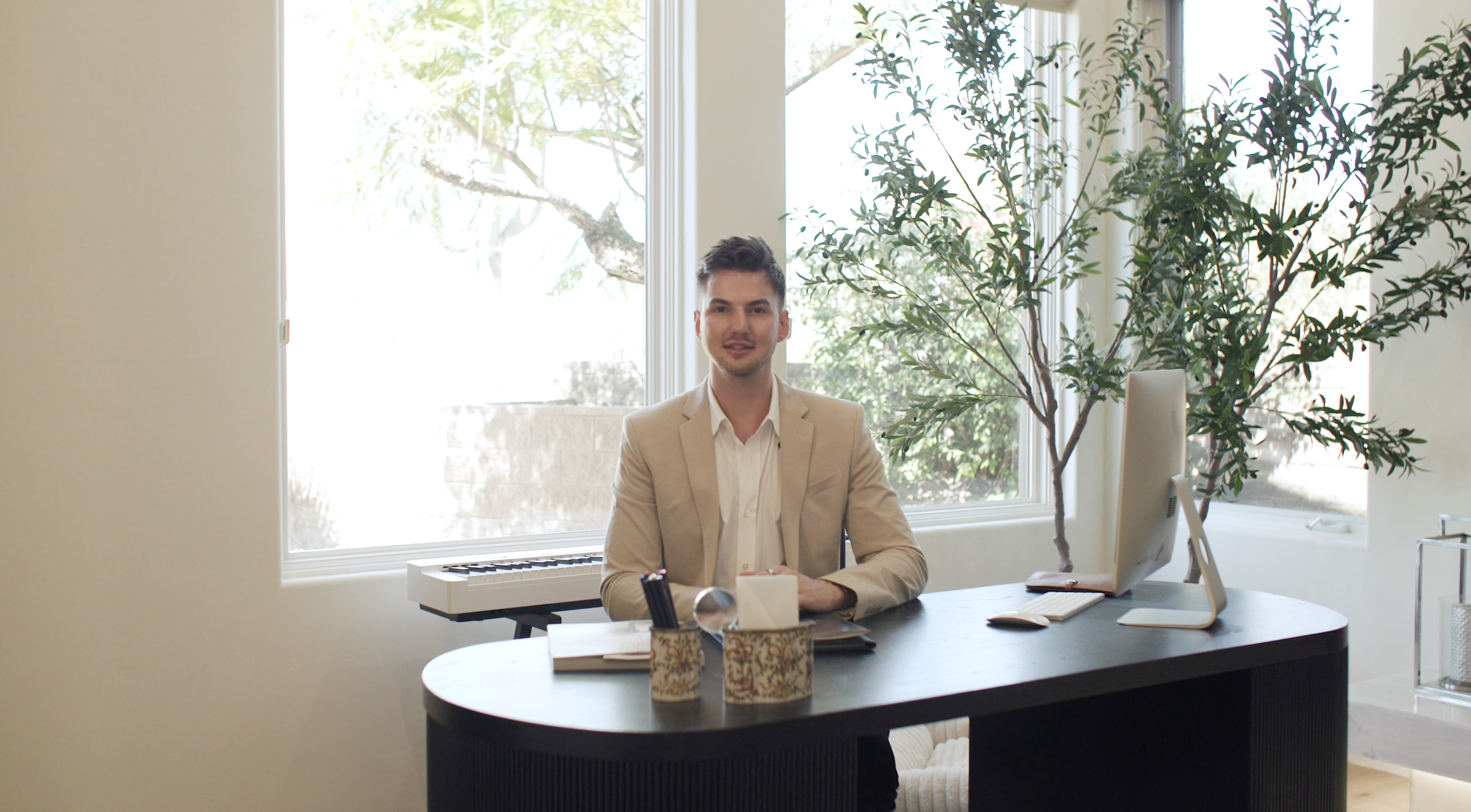 Nolan Nuzum at his desk, Realtor with HomeSmart